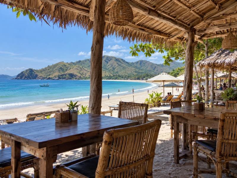 Beachside warungs and shaded seating overlooking Selong Belanak bay